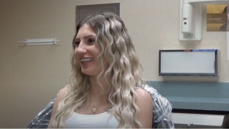 Young woman smiling in a treatment chair