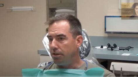 Man sitting in a treatment chair
